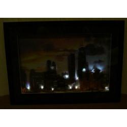 Fotolijst met de skyline van Chicago met verlichting
