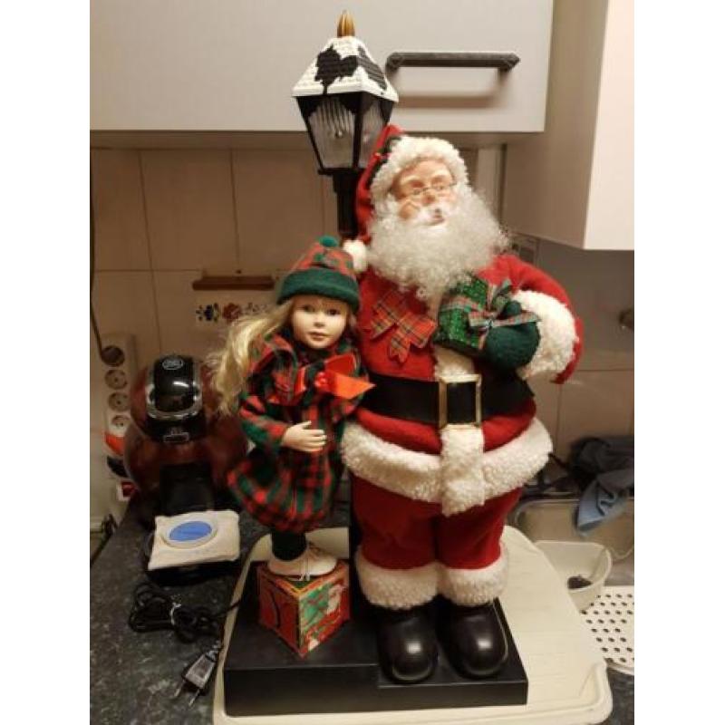 Mooie Beweegbare Kerstman met meisje