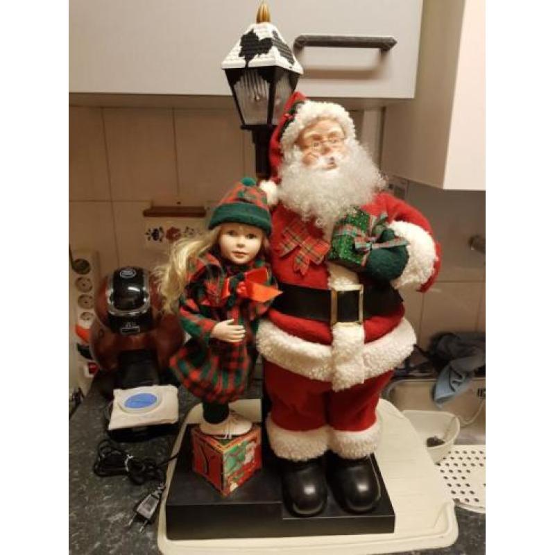 Mooie Beweegbare Kerstman met meisje