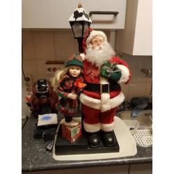 Mooie Beweegbare Kerstman met meisje